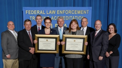 FBI Laboratory Division staff present their certificates for the Hazardous Materials Operations Course and Hazardous Material Crime Scene Operations Course