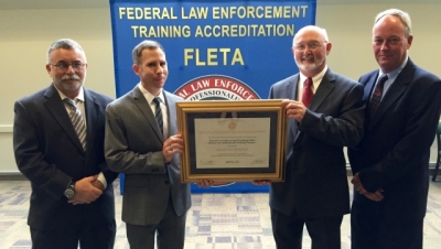 Members from the Federal Law Enforcement Training Centers receive Program Reaccreditation