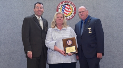 FLETA Board Chair, Brian Peters; Kimberly Canitz; FLETA Office of Accreditation Executive Director, Gary Mitchell, Ph.D.