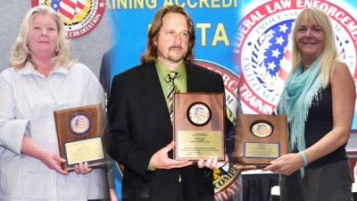 FLETA Team Leaders holding their Recognition Award Plaques