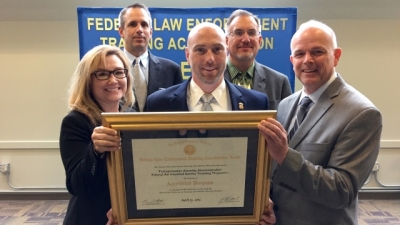 Members from the Transportation Security Administration with their certificate of reaccreditation