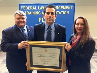 members of the United States Marshals Service receive their certificate of reaccreditation for their program