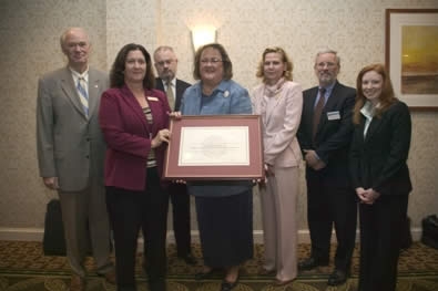 Department of State employees receiving the FLETA Accreditation certificate. Department of State employees receiving the FLETA Accreditation certificate.